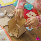 Child focused on building their own wooden robot, a hands-on activity that encourages problem-solving and creativity.