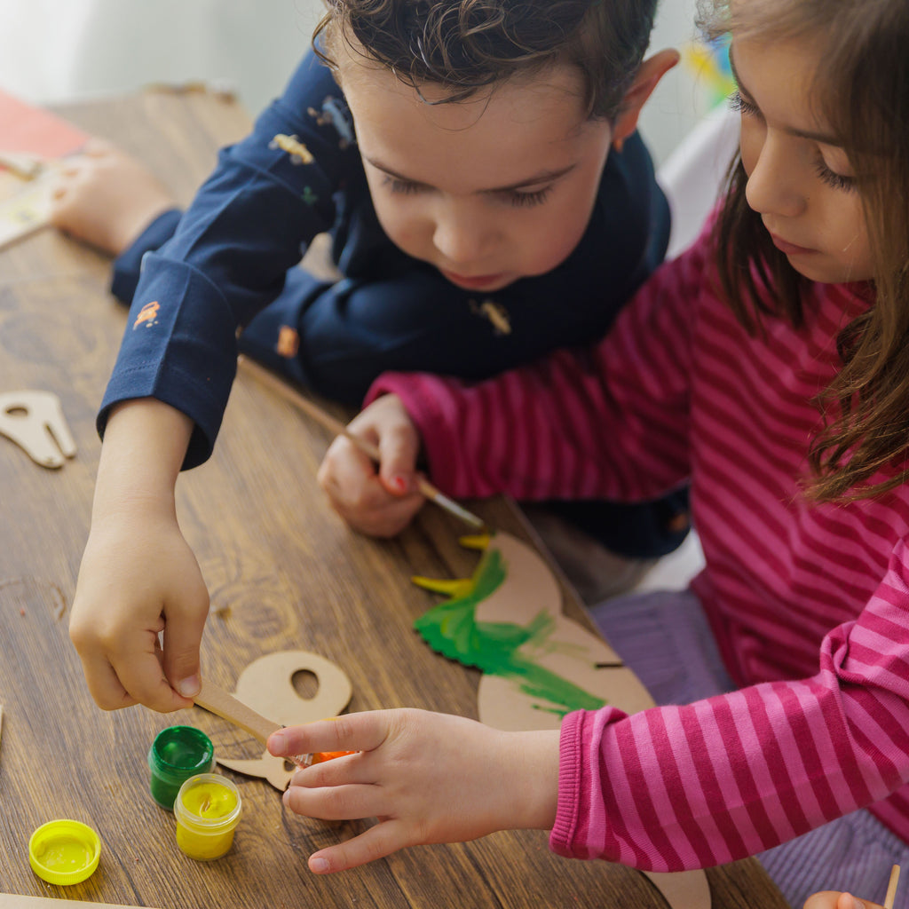 Interactive Dino Building Kit: Build a wooden volcano storage box for your handmade fossils and a paintable dinosaur.