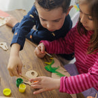 Interactive Dino Building Kit: Build a wooden volcano storage box for your handmade fossils and a paintable dinosaur.