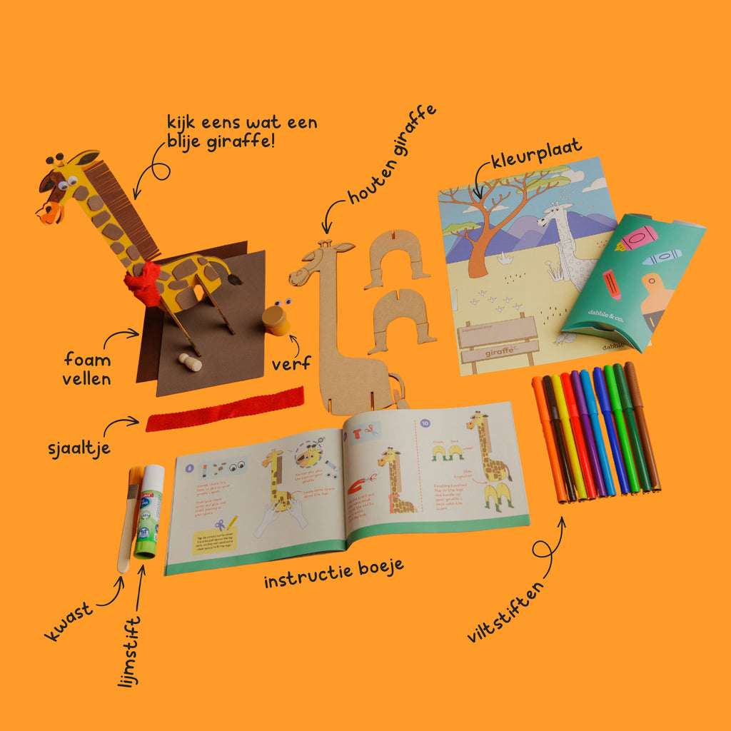 Contents of the Happy Giraffe craft box: including wooden giraffe, paint, markers, foam sheets, brown cardstock, and all supplies needed to start immediately.