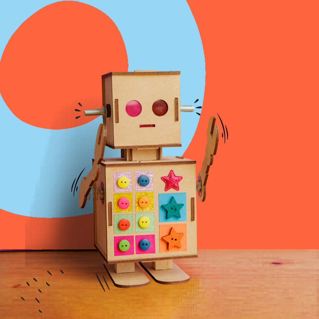 Dabble & Co. Robbie the Robot craft kit: a complete DIY set with a wooden robot, metal spring arms, and a built-in light for glowing eyes.