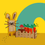 Dabble & Co. Bunny and the Carrot Patch craft kit: a complete DIY set featuring a popsicle stick bunny and a carrot patch made from wooden carrots and orange pipe cleaners.