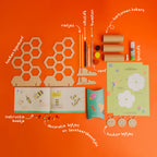 he Bee Hotel craft kit by Dabble & Co. featuring a wooden beehive, miniature bees and ladybugs, and materials to make tube bees.