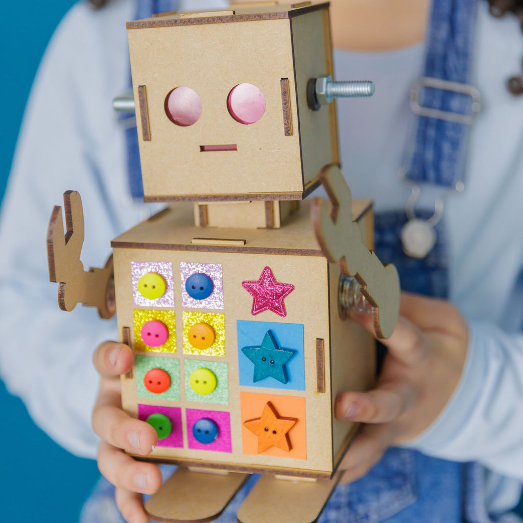 The finished Robbie the Robot project with glowing transparent eyes and movable spring arms.