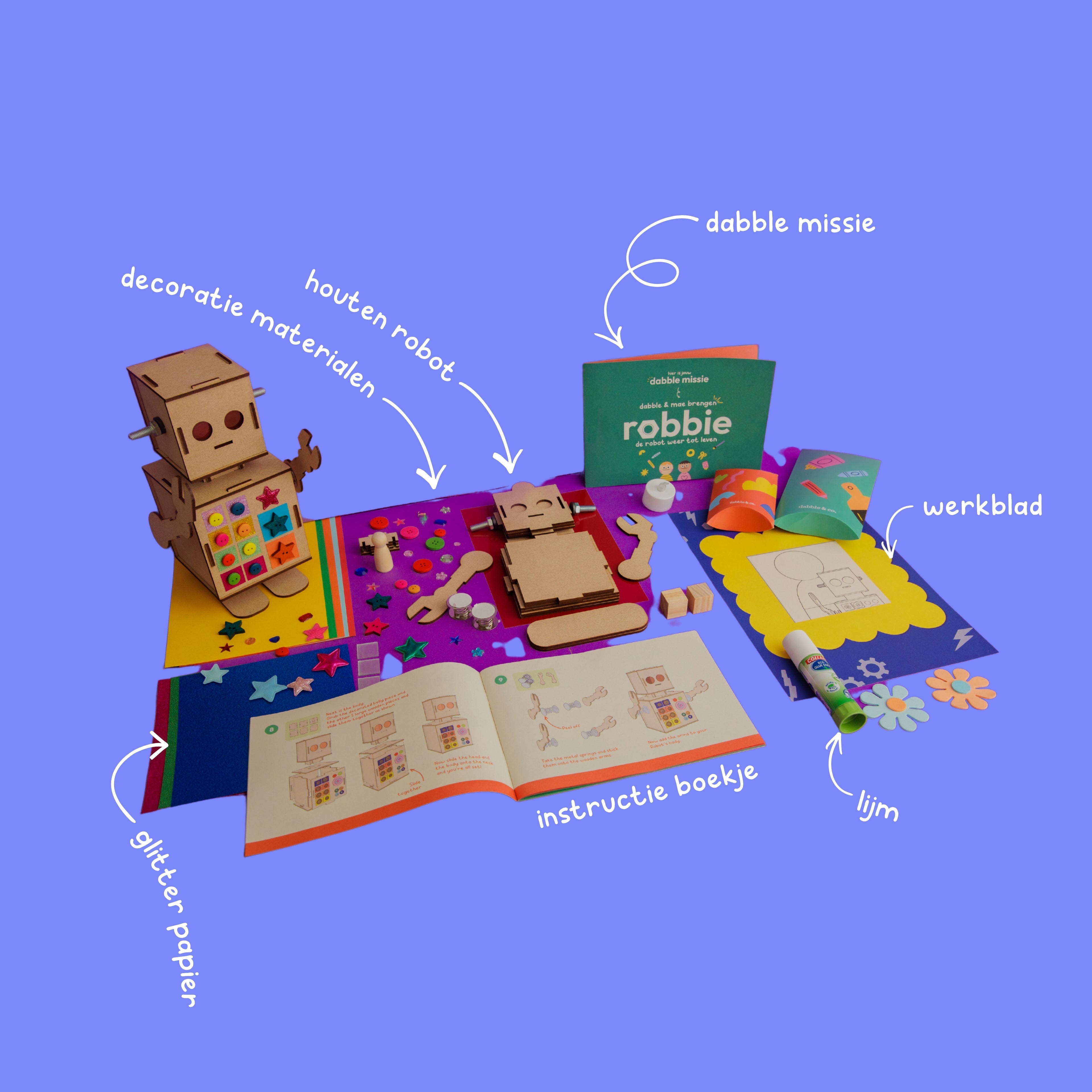 The contents of the Robbie the Robot box, featuring mirror mosaic tiles, rhinestones, glitter paper, and mechanical springs.